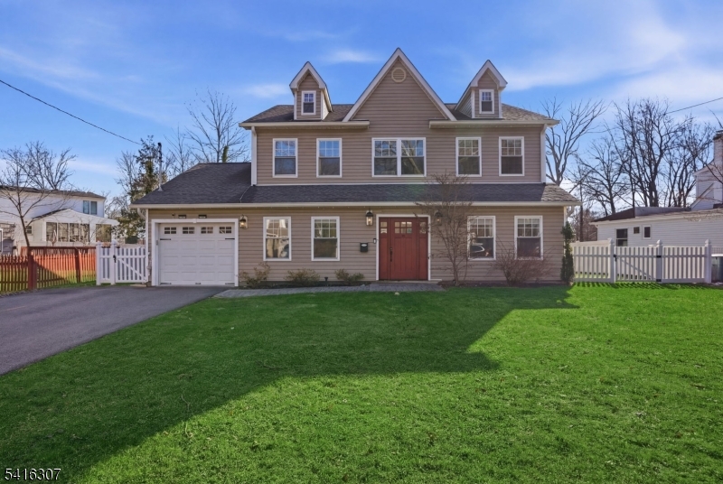 44 Manor Road Livingston, NJ 07039 - Photo 1 of 48 a view of a yard in front of a house with large windows