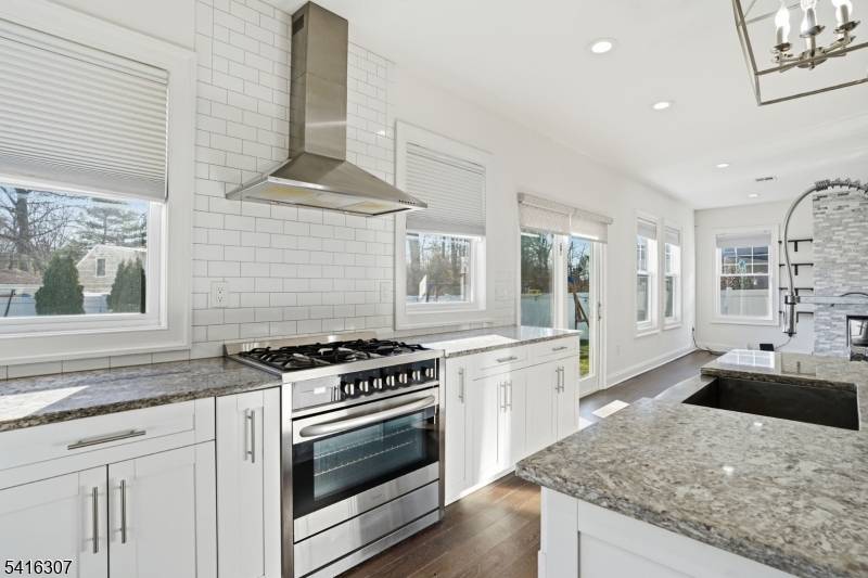 44 Manor Road Livingston, NJ 07039 - Photo 12 of 48 a kitchen with granite countertop a stove and a sink