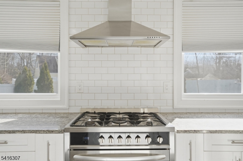 44 Manor Road Livingston, NJ 07039 - Photo 14 of 48 a stove top oven sitting inside of a kitchen