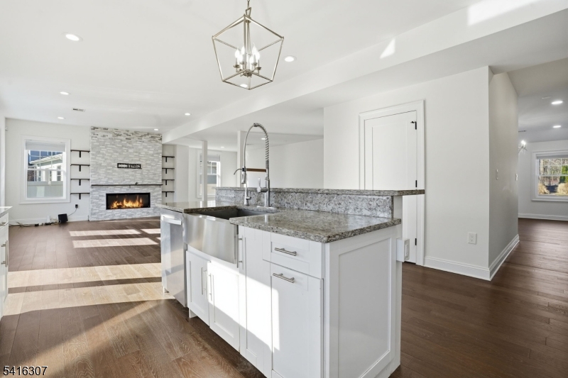 44 Manor Road Livingston, NJ 07039 - Photo 15 of 48 a kitchen with stainless steel appliances granite countertop a refrigerator and a stove top oven
