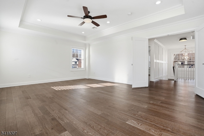 44 Manor Road Livingston, NJ 07039 - Photo 19 of 48 a view of empty room with wooden floor
