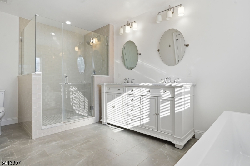 44 Manor Road Livingston, NJ 07039 - Photo 22 of 48 a view of a mirror light fixtures and entryway