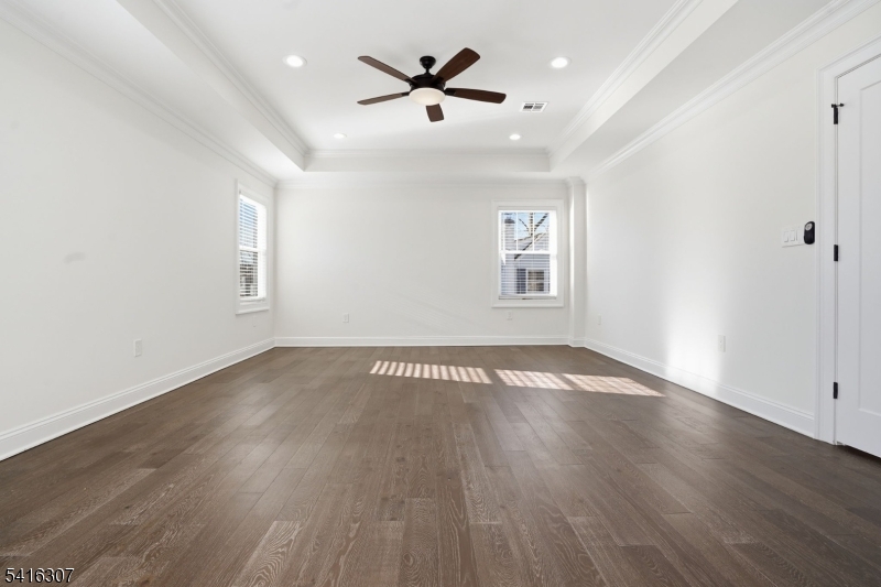 44 Manor Road Livingston, NJ 07039 - Photo 26 of 48 an empty room with wooden floor and windows