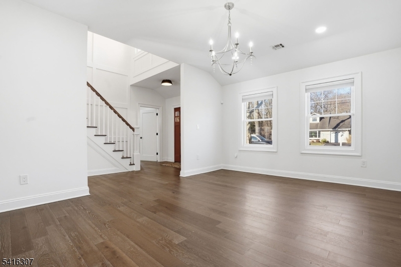 44 Manor Road Livingston, NJ 07039 - Photo 4 of 48 a view of an room with wooden floor chandelier and windows