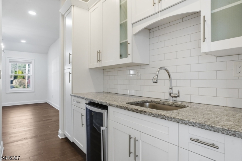 44 Manor Road Livingston, NJ 07039 - Photo 9 of 48 a kitchen with granite countertop white cabinets and a sink