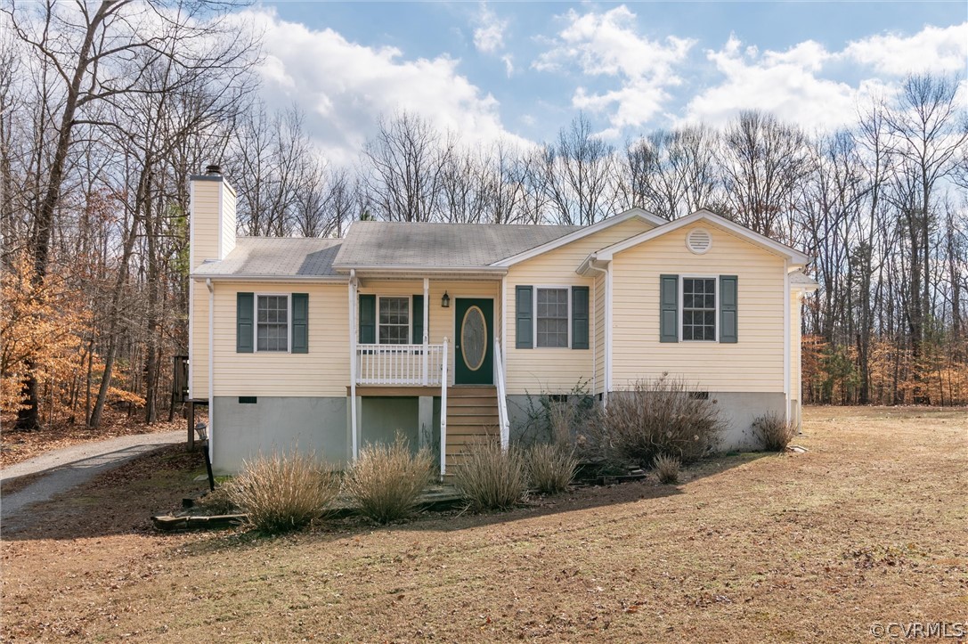 3165 Sandy Hook Road Sandy Hook, VA 23153 - Photo 1 of 25 a front view of a house with garden
