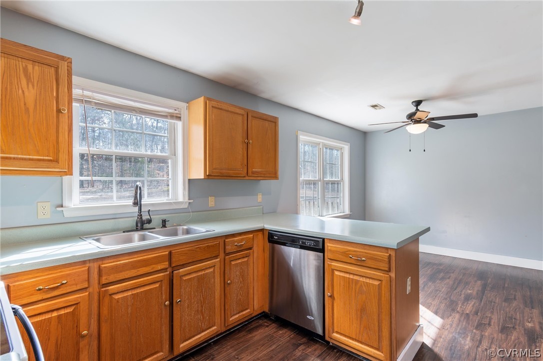 3165 Sandy Hook Road Sandy Hook, VA 23153 - Photo 6 of 25 a kitchen with stainless steel appliances granite countertop a sink a stove cabinets and wooden floor