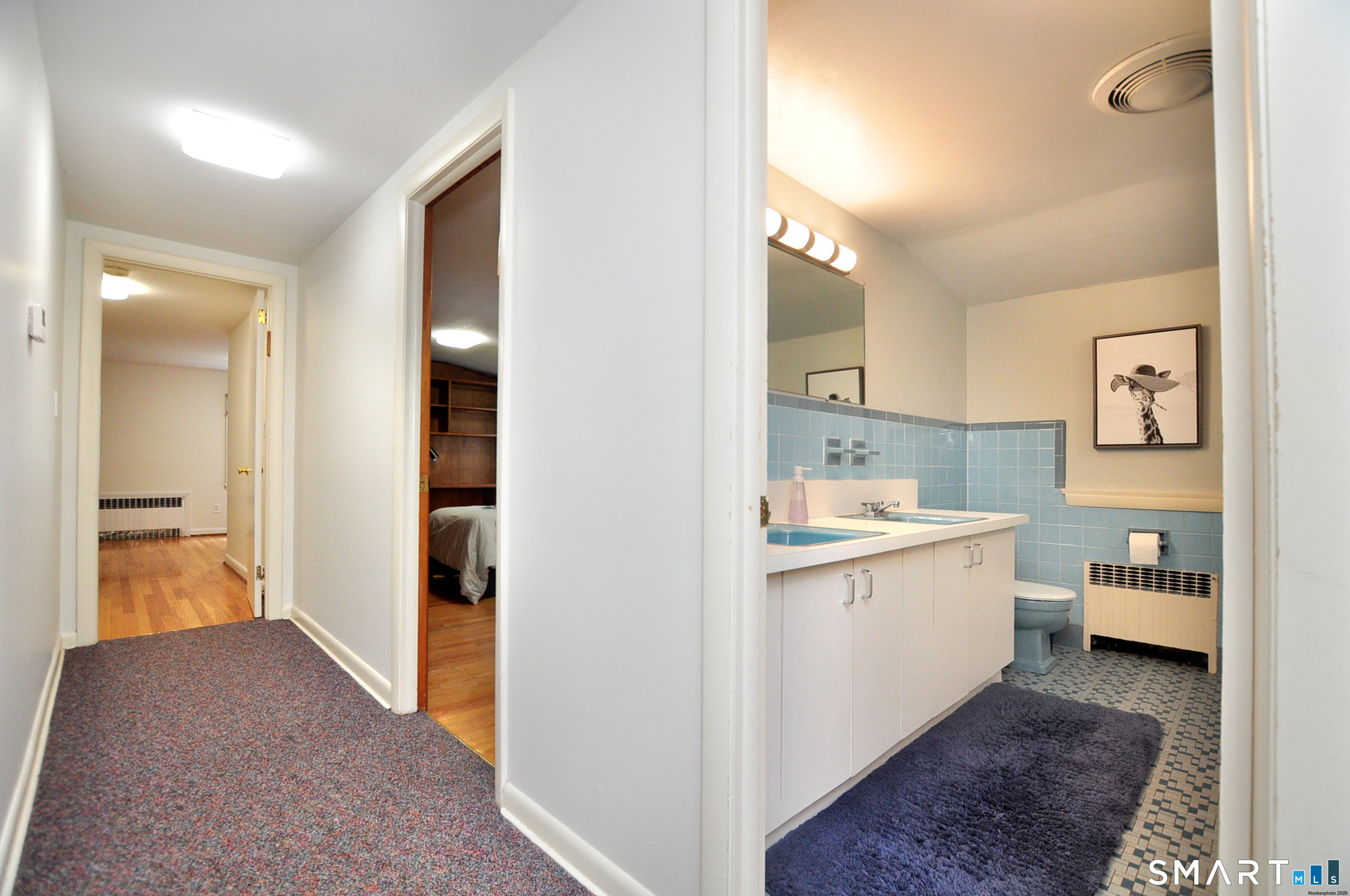 44 Miamis Road West Hartford, CT 06117 - Photo 26 of 39 a view of a kitchen with a sink and dishwasher with wooden floor