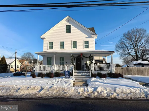 a view of a house with cars on roof