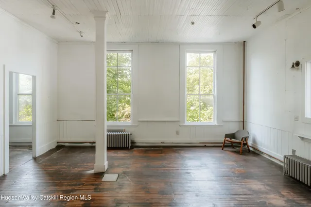 a view of entryway with wooden floor
