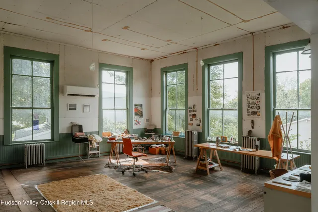 a living room with a table and a window