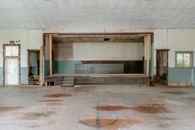 a room with a table and chairs