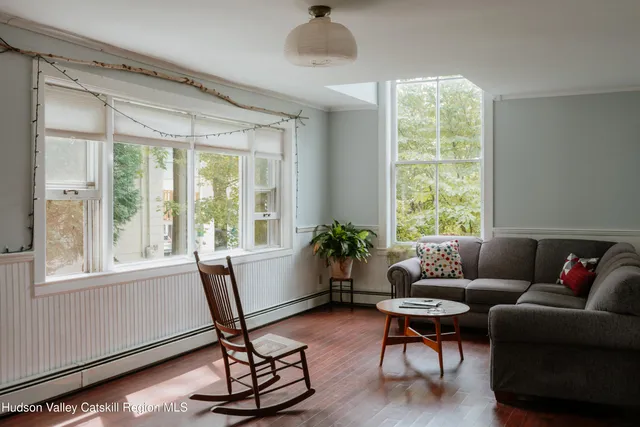 a dining room with furniture and a chandelier