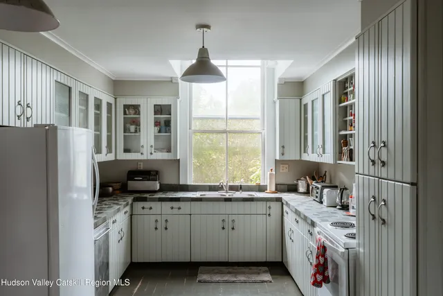 a bedroom with bed and window