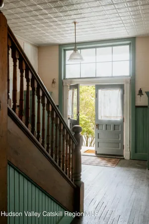 a view of a porch with wooden floor and stairs