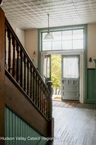 a view of a porch with wooden floor and stairs