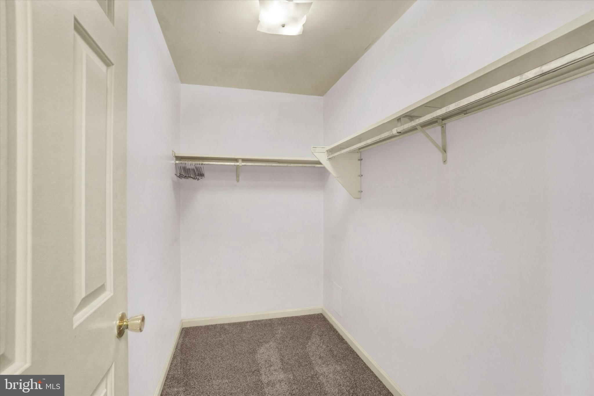 305 Chambers Ridge, Unit 305 York, PA 17402 - Photo 15 of 28 Spacious walkin closet with ample storage options.