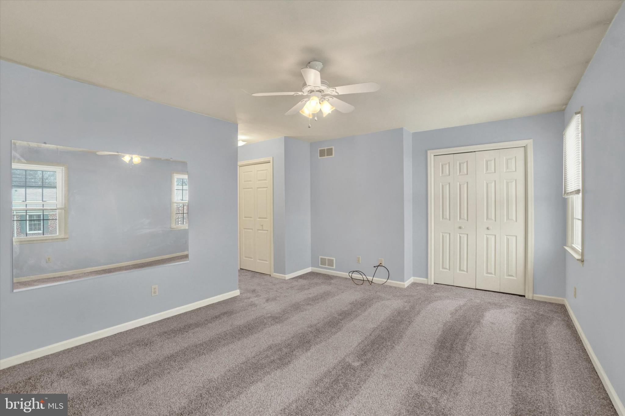 305 Chambers Ridge, Unit 305 York, PA 17402 - Photo 17 of 28 Spacious room with soft blue hues.