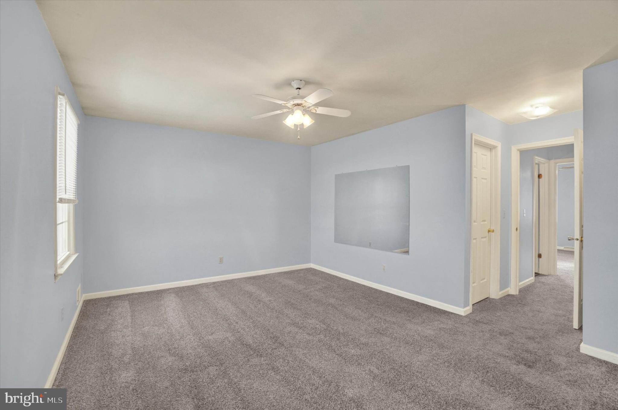305 Chambers Ridge, Unit 305 York, PA 17402 - Photo 18 of 28 Spacious room with soft blue hues.