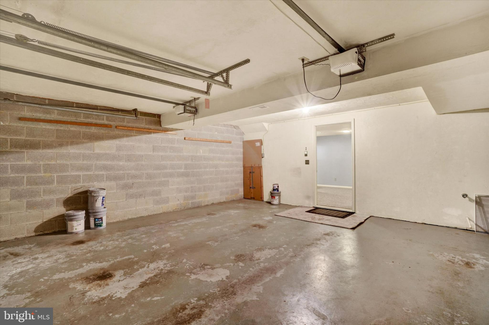 305 Chambers Ridge, Unit 305 York, PA 17402 - Photo 21 of 28 Spacious garage with potential for creativity.