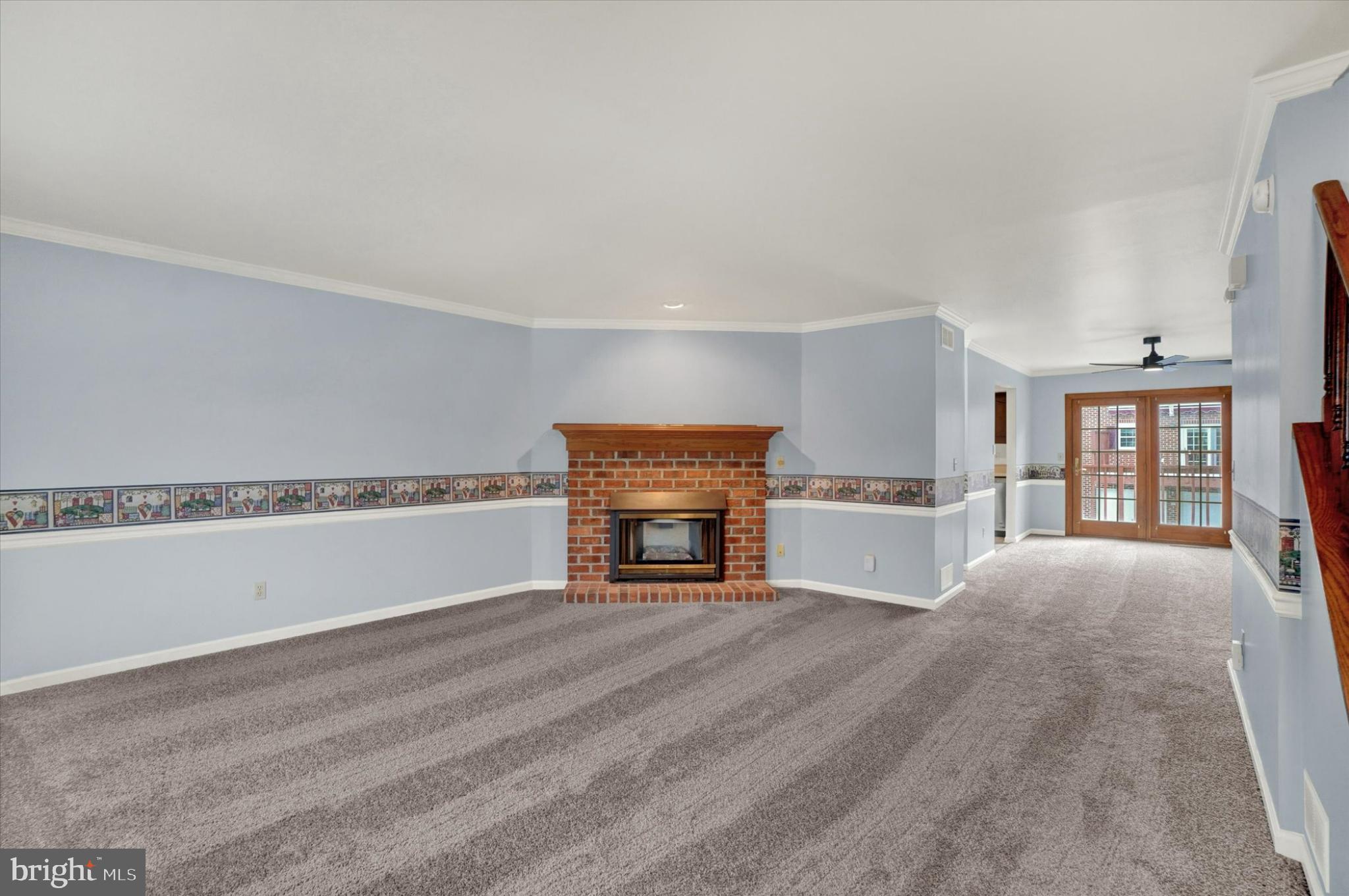 305 Chambers Ridge, Unit 305 York, PA 17402 - Photo 4 of 28 Spacious living area with charming fireplace.