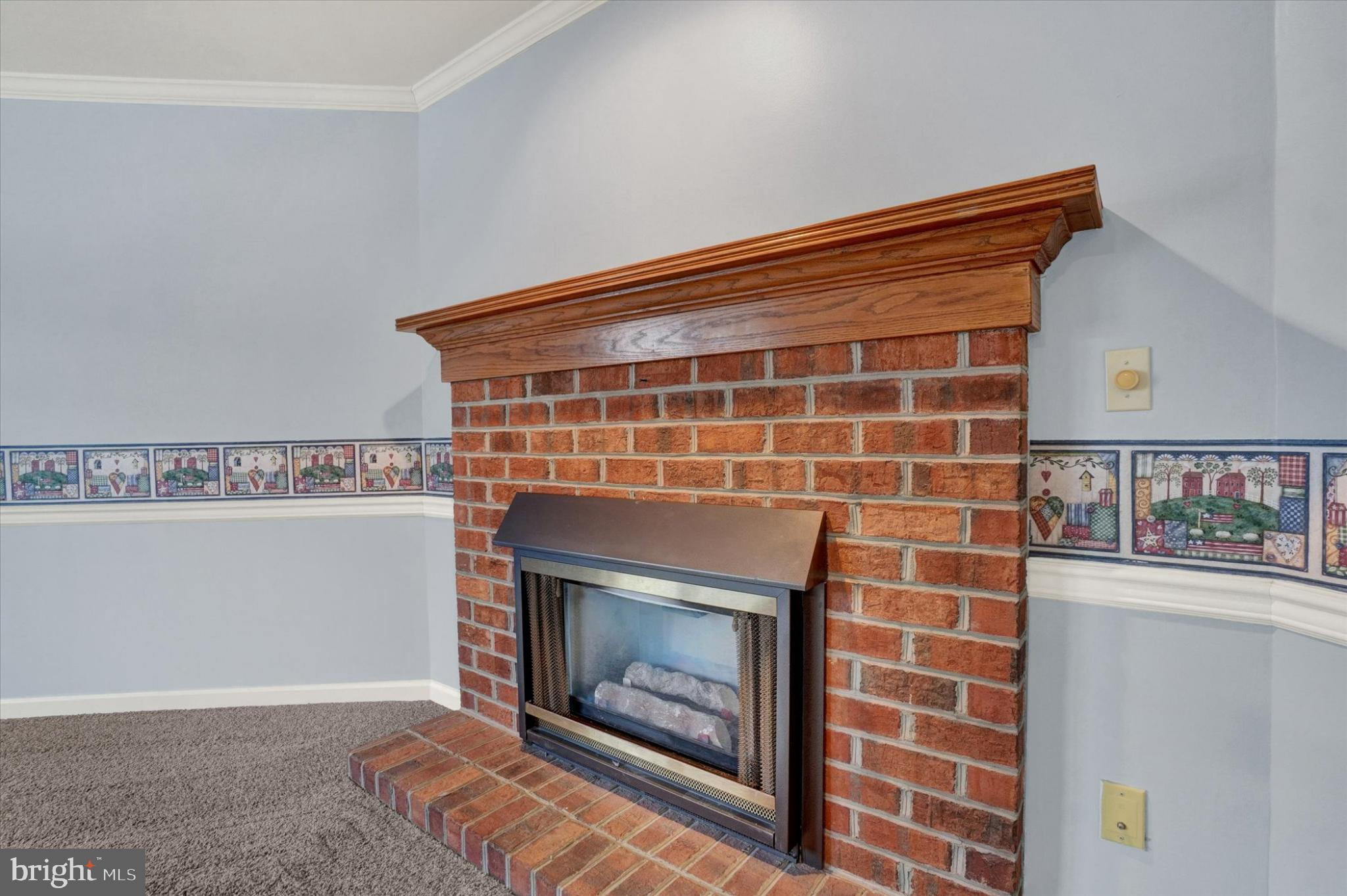 305 Chambers Ridge, Unit 305 York, PA 17402 - Photo 5 of 28 Cozy brick fireplace with charming details.