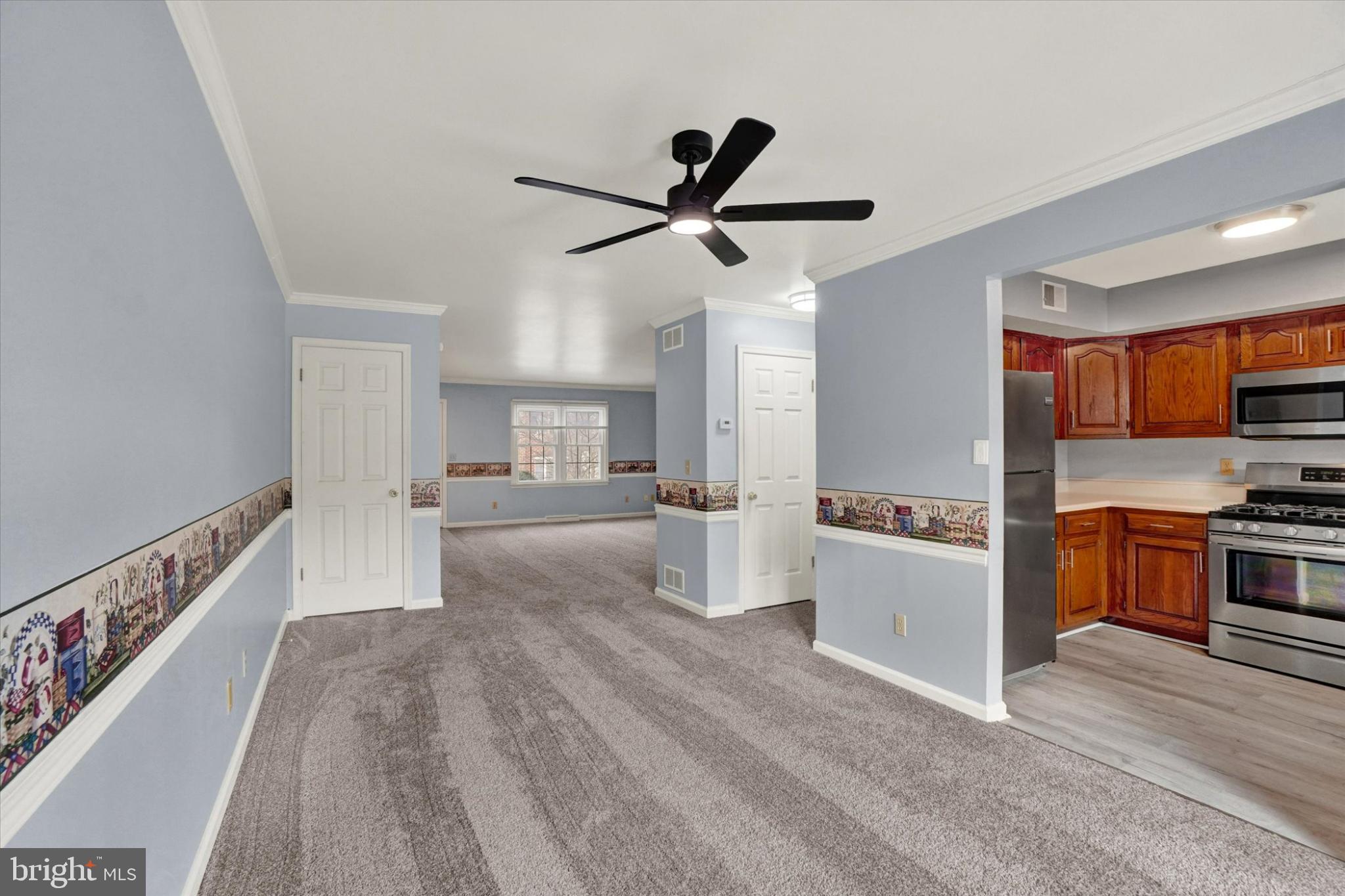 305 Chambers Ridge, Unit 305 York, PA 17402 - Photo 7 of 28 Spacious living area with modern kitchen.