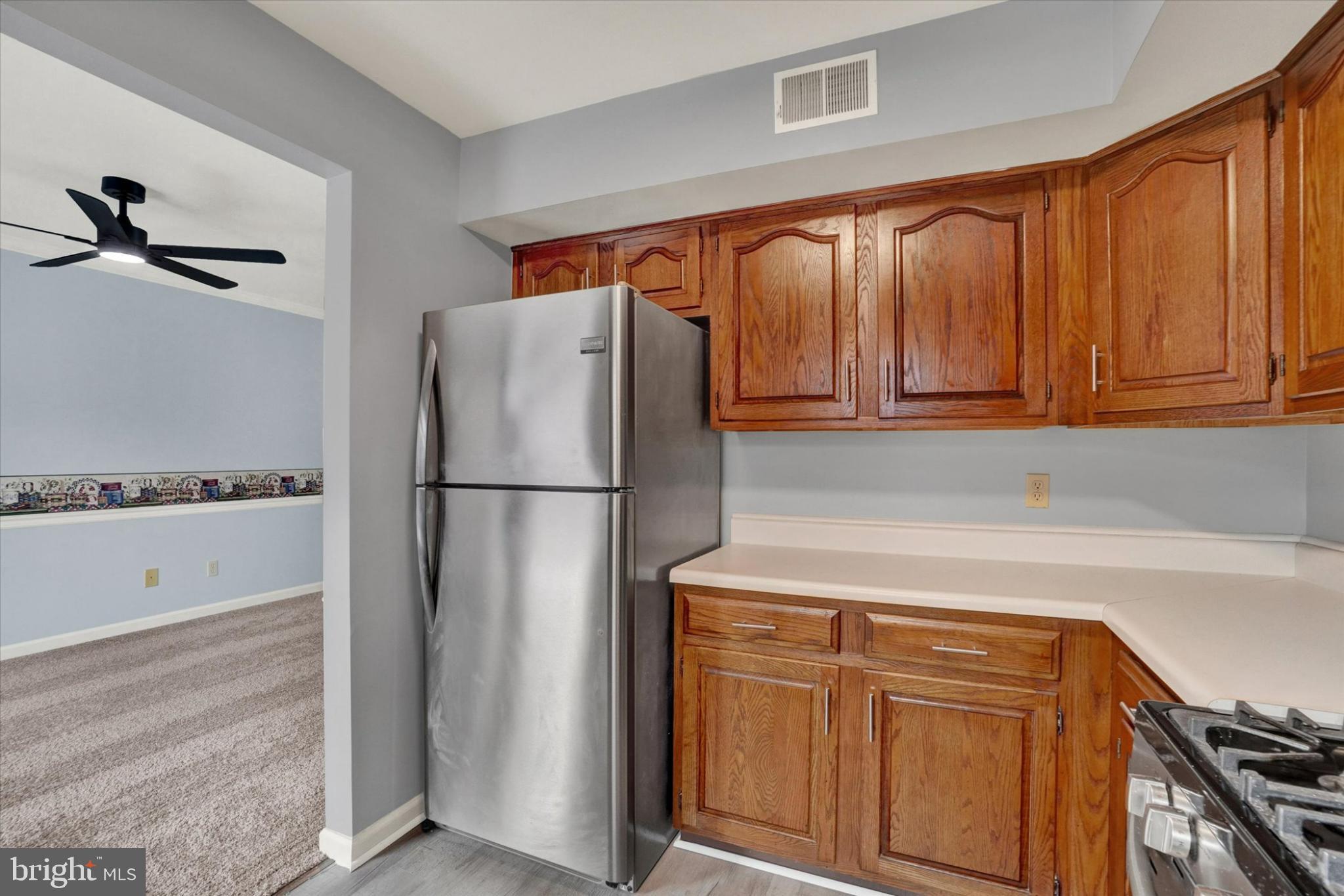 305 Chambers Ridge, Unit 305 York, PA 17402 - Photo 10 of 28 Modern kitchen with warm wood accents.