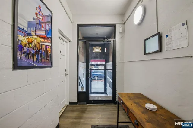 a view of a hallway with paintings on the wall