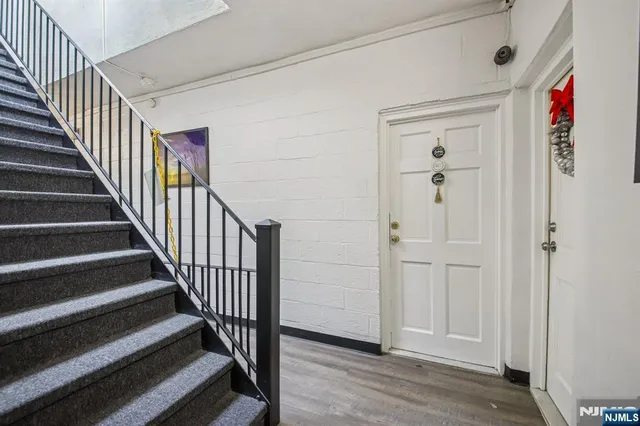 a view of entryway with wooden floor