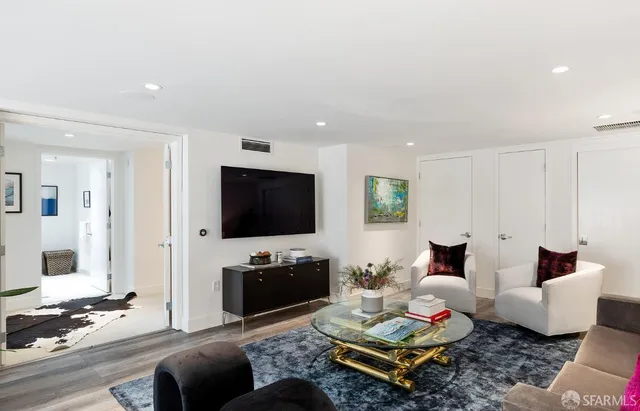 a living room with furniture and a table