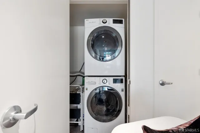 a bedroom with a large bed and a couch