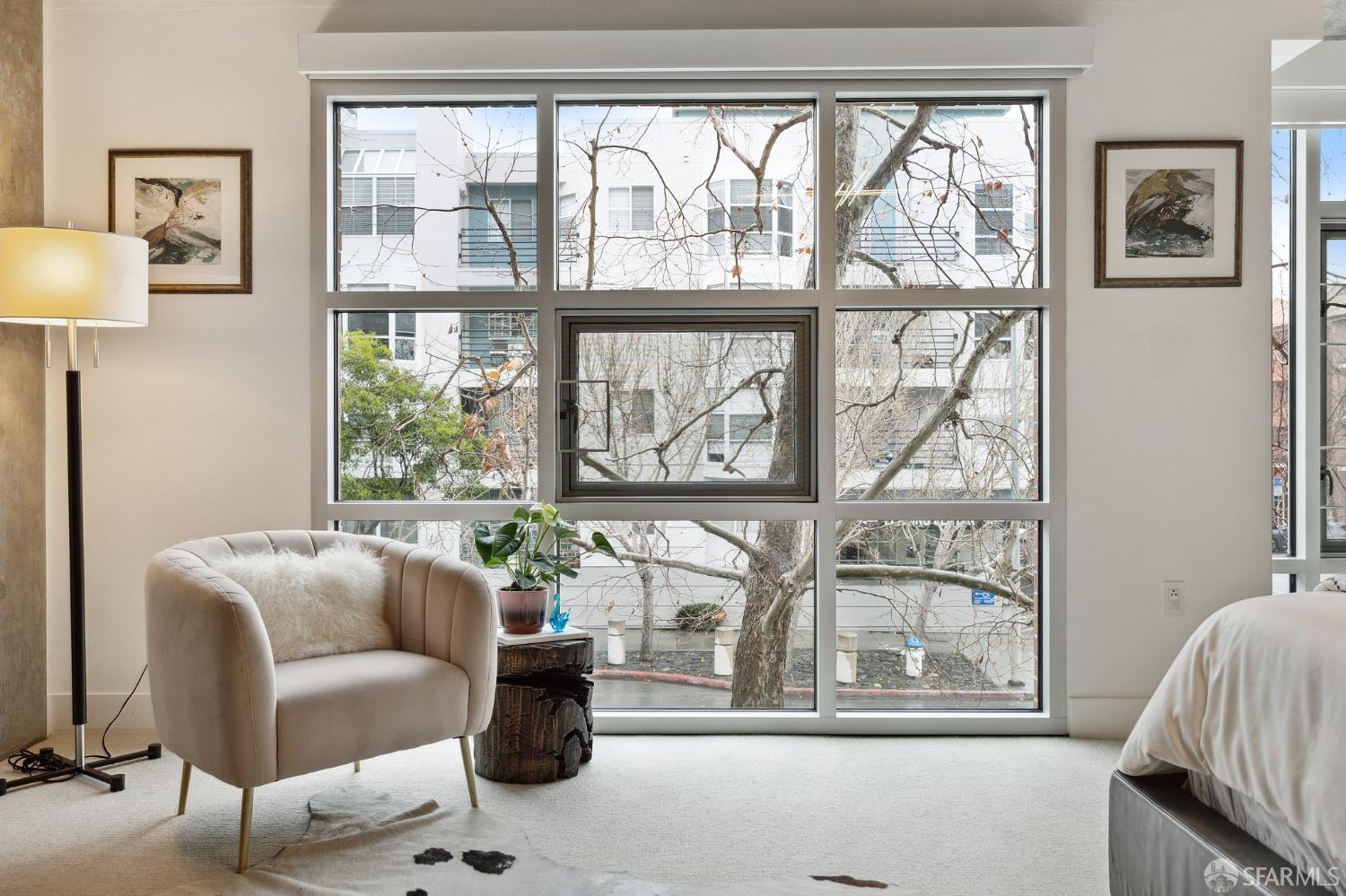 200 Brannan Street, Unit 130 San Francisco, CA 94107 - Photo 31 of 43 a living room with furniture and a large window