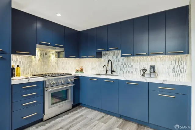 a kitchen with granite countertop wooden cabinets and white appliances