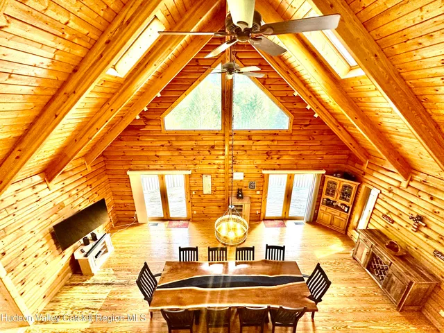 a view of staircase with railing and large windows