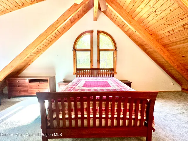 a bed room with a bed and a window