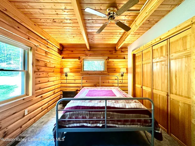 a bed sitting in a room next to a blue building