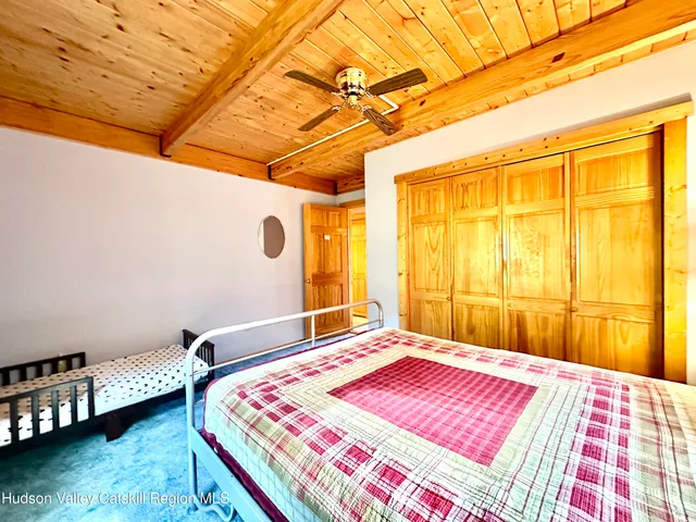 a bedroom with furniture and a window