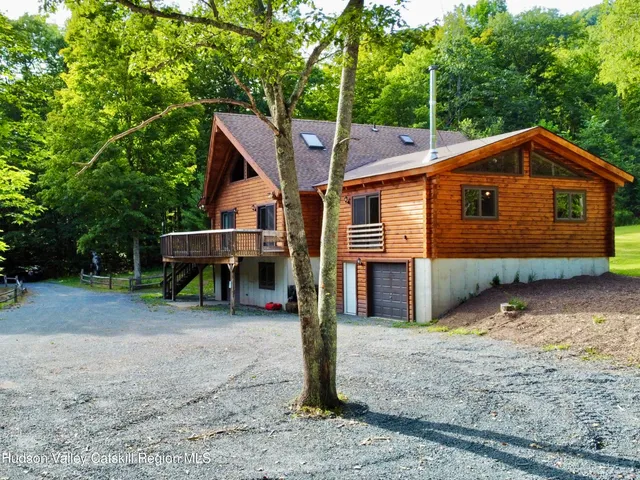 a balcony with wooden floor and fence