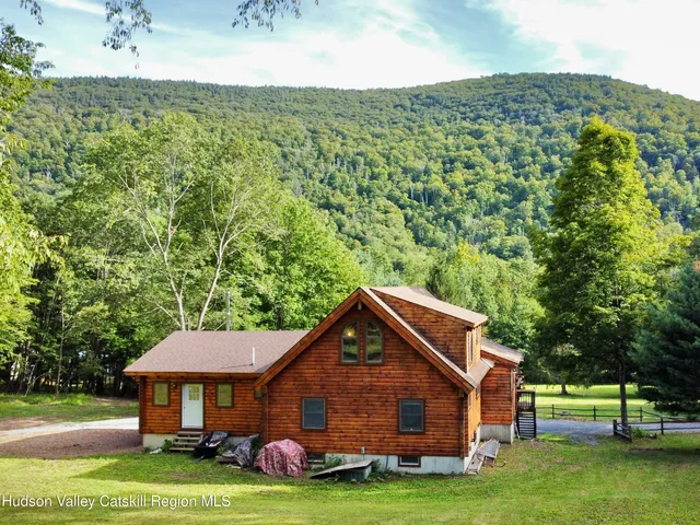 a balcony with wooden floor and fence