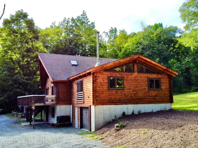 a view of a green field with lots of bushes