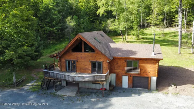a view of a city with lush green forest