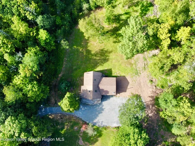 a view of a garage with a computer on a desk