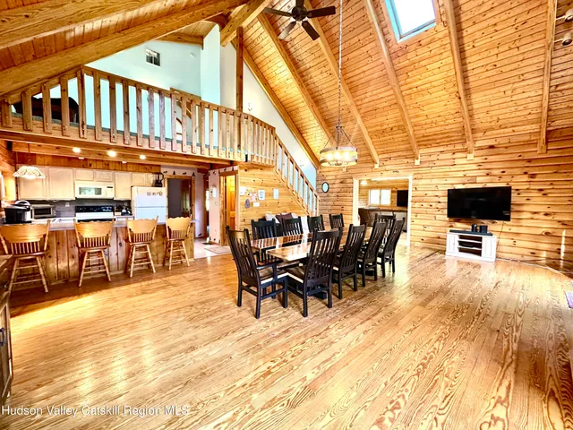 a view of a patio with table and chairs