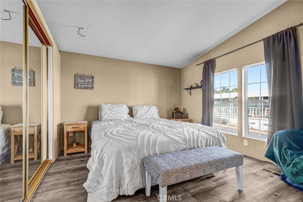 1051 Site Drive, Unit 51 Brea, CA 92821 - Photo 20 of 32 a bedroom with a bed and a large window