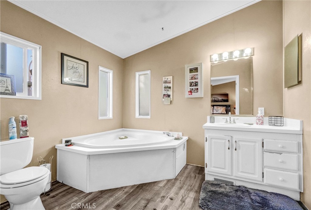 1051 Site Drive, Unit 51 Brea, CA 92821 - Photo 23 of 32 a bathroom with a double vanity sink mirror and toilet