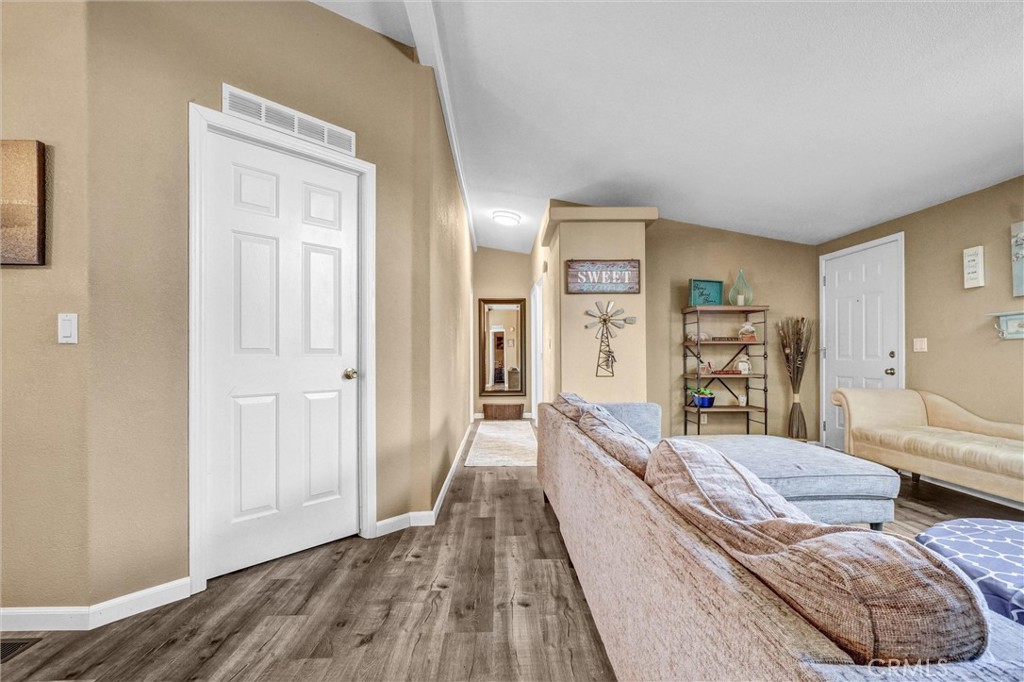 1051 Site Drive, Unit 51 Brea, CA 92821 - Photo 27 of 32 a living room with furniture and a wooden floor