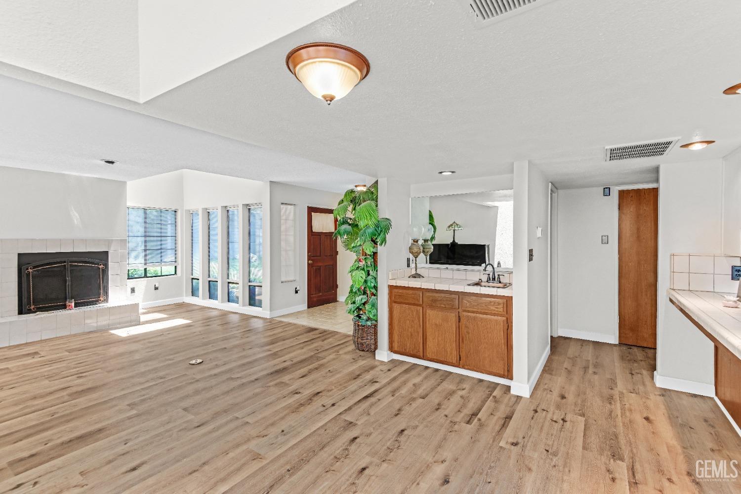 Undisclosed Address Bakersfield, CA 93309 - Photo 14 of 38 a kitchen with a refrigerator and a stove top oven