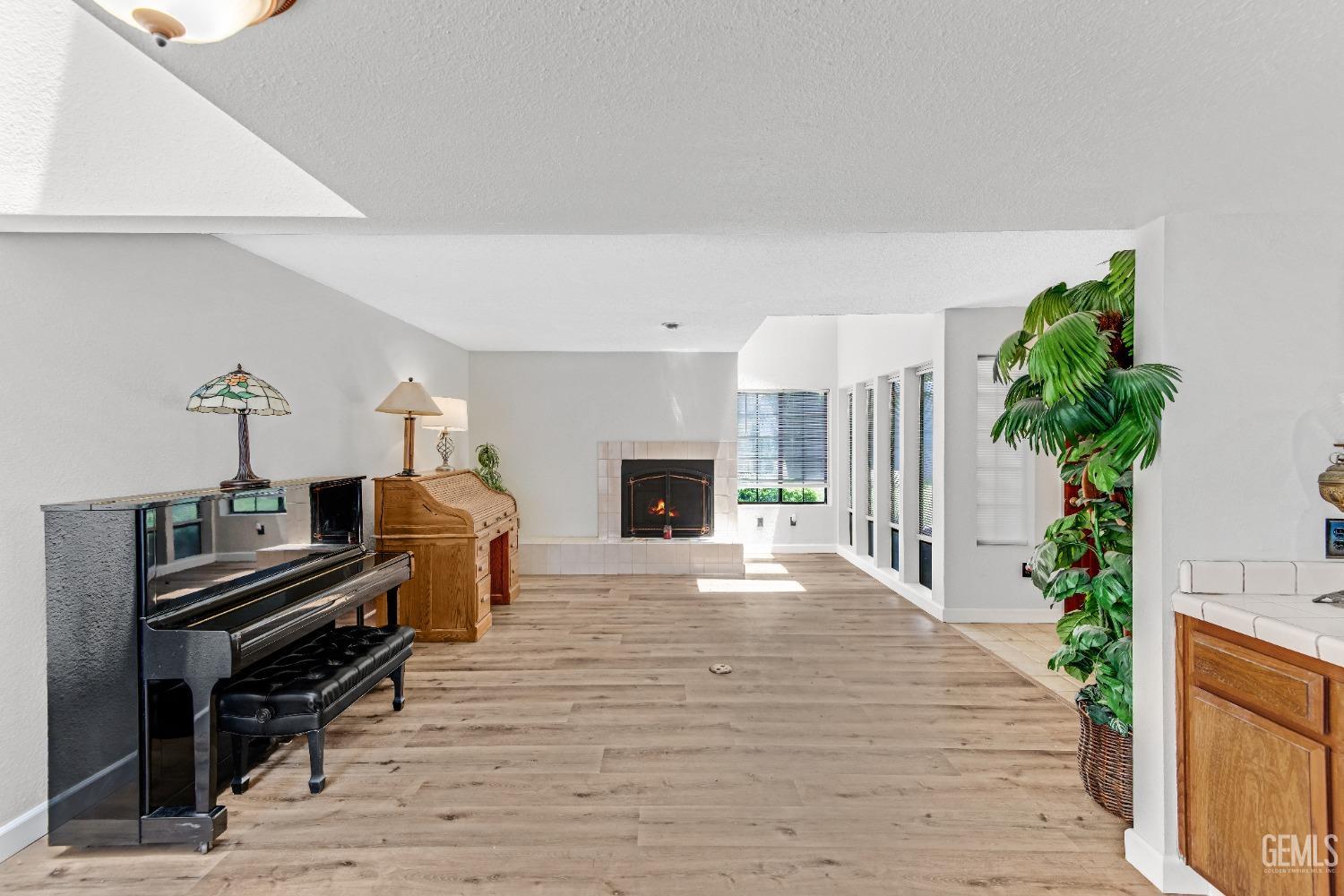 Undisclosed Address Bakersfield, CA 93309 - Photo 15 of 38 a living room with furniture and a fireplace