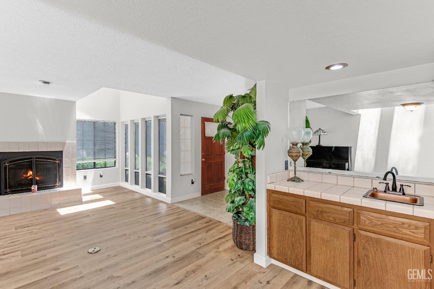 Undisclosed Address Bakersfield, CA 93309 - Photo 16 of 38 a spacious bathroom with a double vanity sink and a mirror
